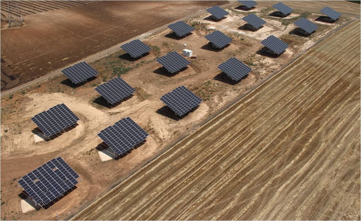 Dual-axis solar trackers in an agricultural field